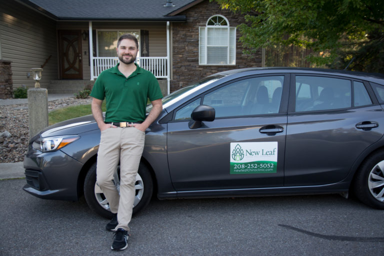 Image of Dr. Mason Stewart of New Leaf House Call Chiropractic in Post Falls, ID, standing next to his car to emphasize that we do house calls.