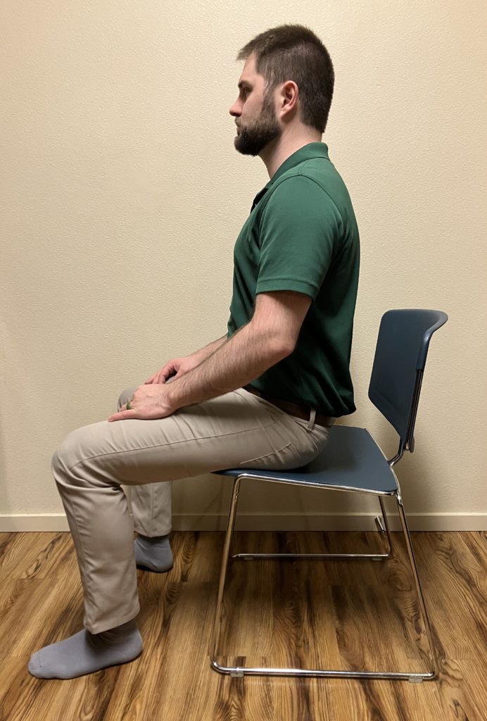 Sitting, Head upright, straight back, neutral pelvis, feet flat on floor